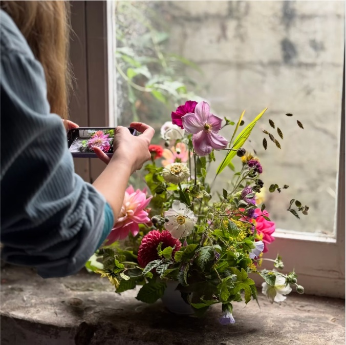 Meadowlark arrangement being photographed